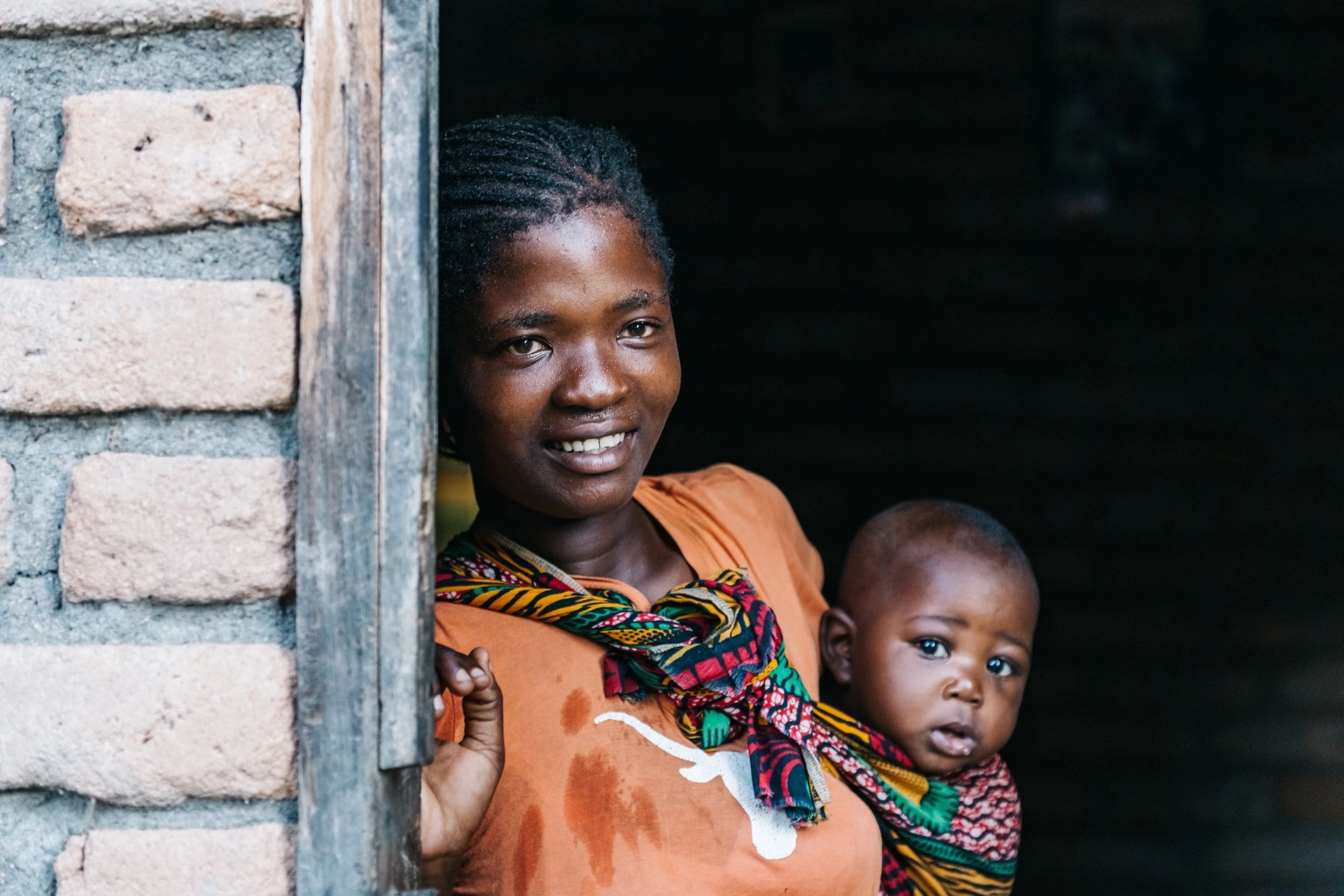 Woman and child smiling — a gift of health