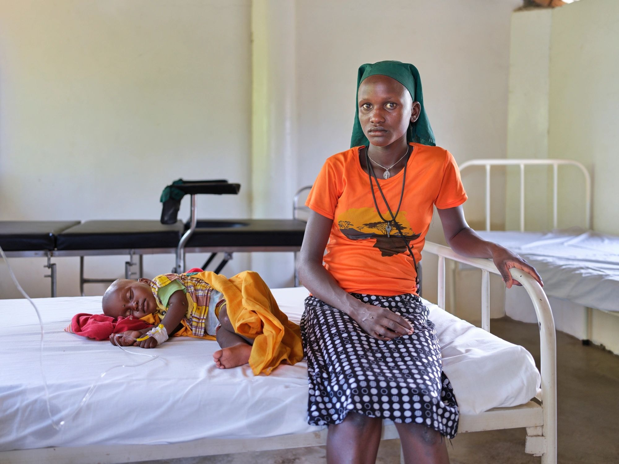 Mother with child in hospital — sustained care